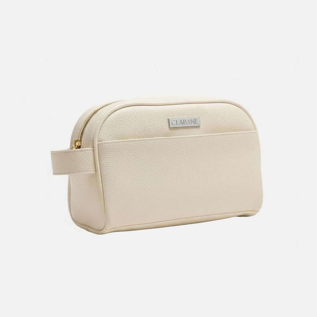 Cream toiletry bag with gold zipper and &