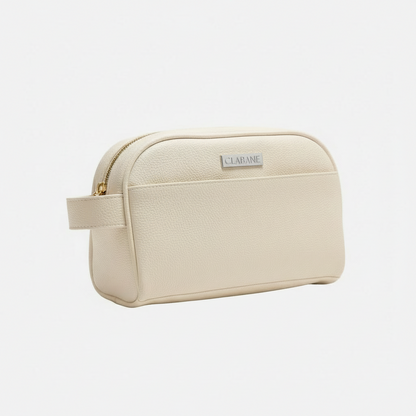 Cream toiletry bag with gold zipper and &