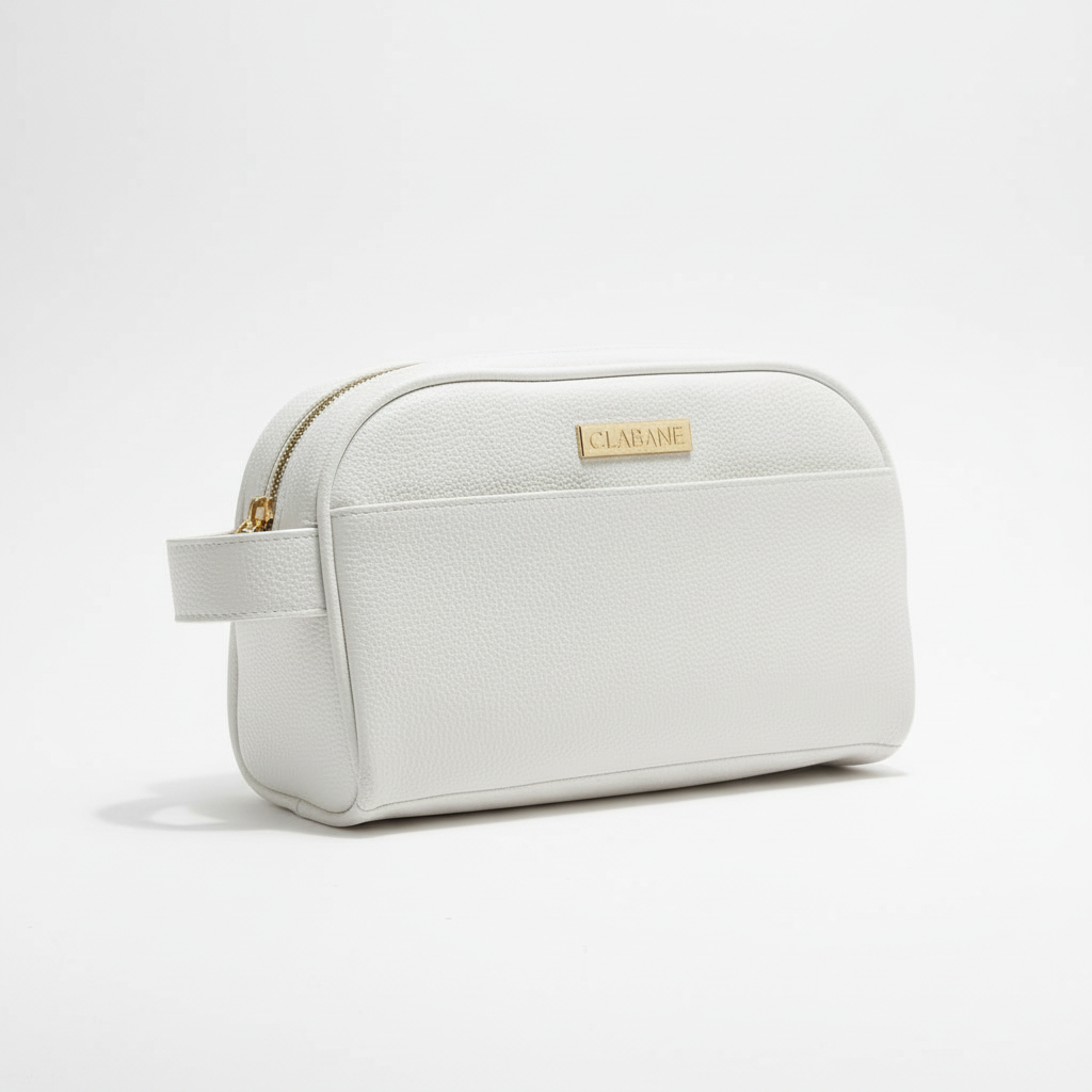 White toiletry bag with gold zipper and &