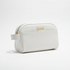 White toiletry bag with gold zipper and &