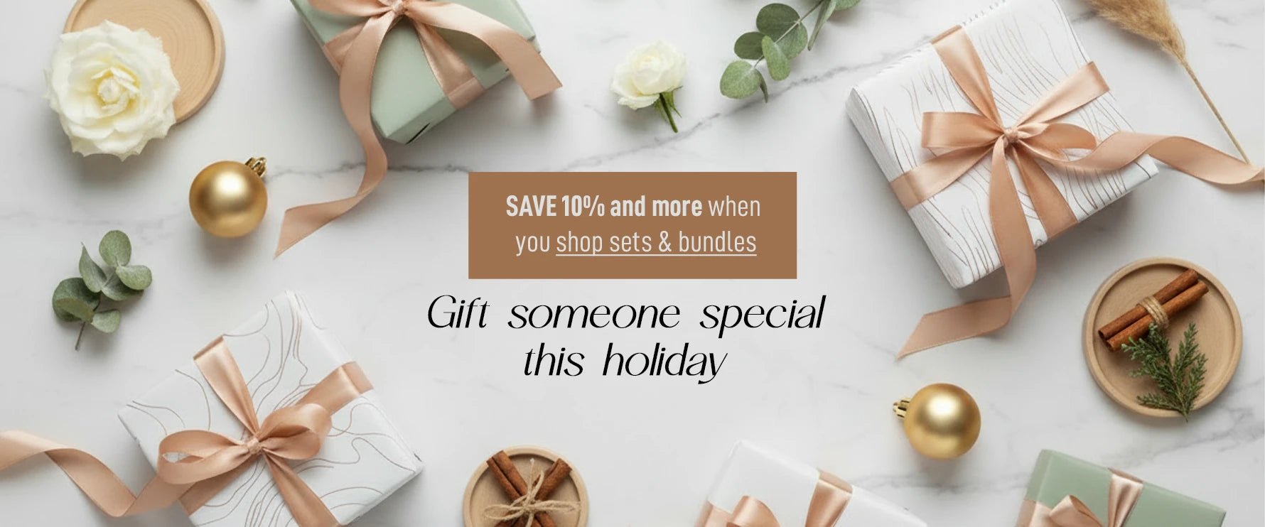 Gift boxes with ribbons and holiday decorations on a white surface, Gift someone special this holiday with Clabane